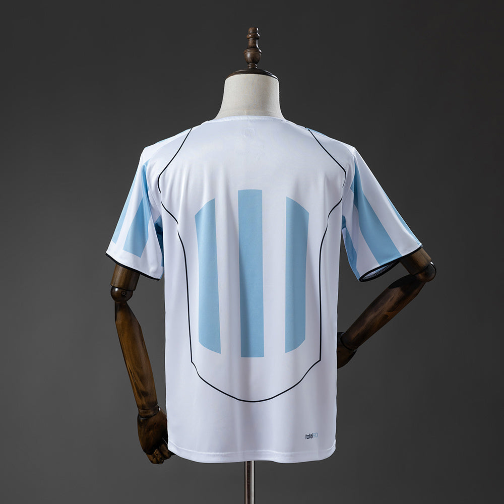 Camiseta T90 2025 - Blanca y Azul